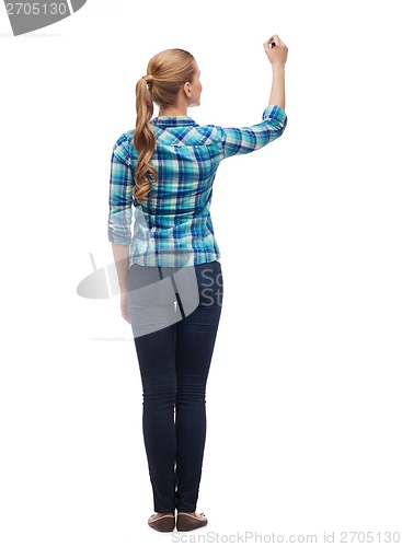 Image of woman from the back writing something in the air