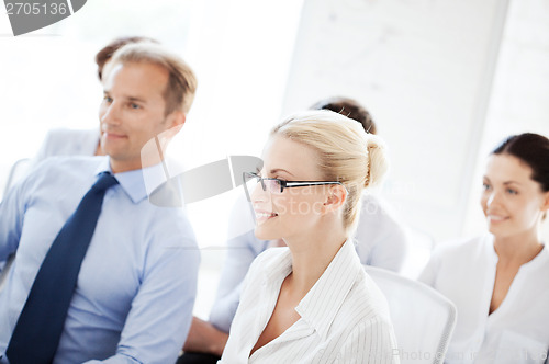Image of businessmen and businesswomen on conference