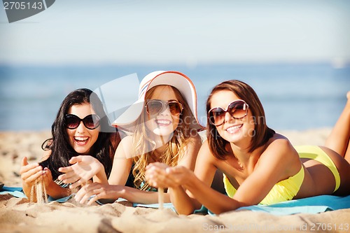 Image of girls sunbathing on the beach