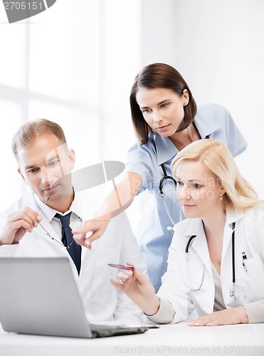 Image of doctors looking at laptop on meeting