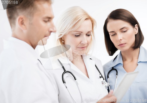 Image of doctors looking at tablet pc