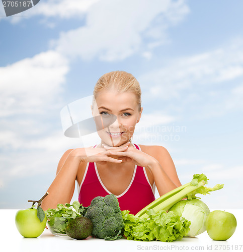 Image of smiling sporty woman with organic food