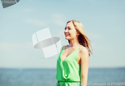 Image of girl standing on the beach