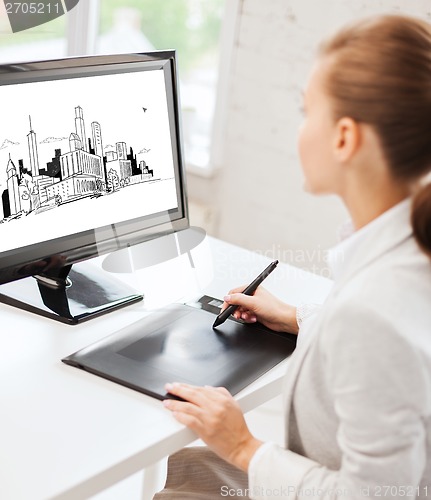 Image of architect with drawing tablet in office