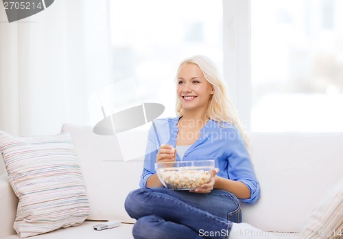 Image of young girl with popcorn ready to watch movie