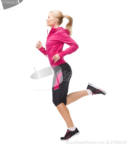 Image of sporty woman running or jumping