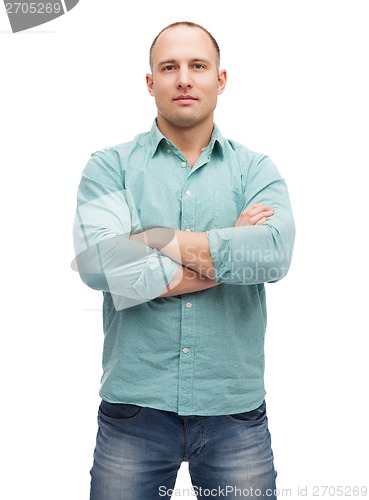 Image of calm man with crossed arms