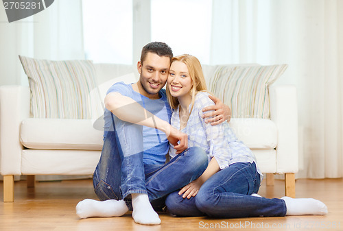 Image of smiling happy couple at home
