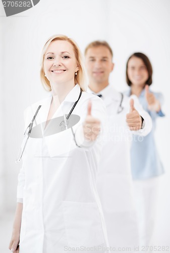 Image of team of doctors showing thumbs up