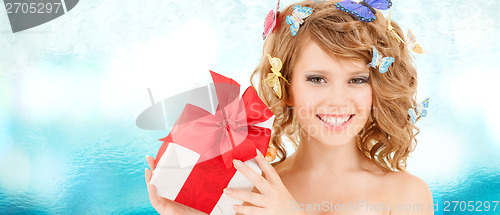 Image of teenager with butterflies in hair showing present