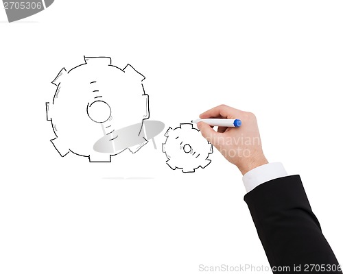 Image of close up of businessman drawing cogwheel