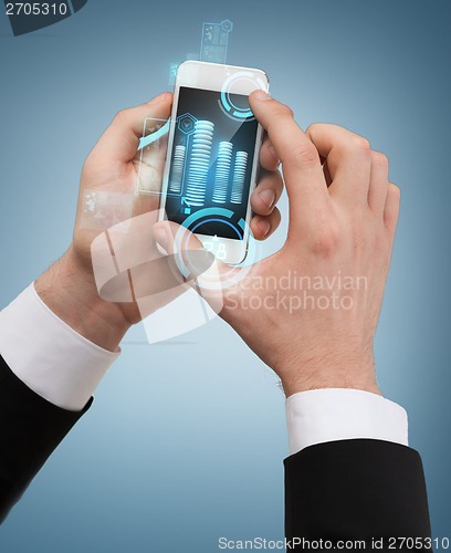 Image of businessman touching screen of smartphone