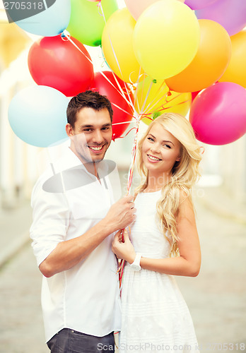 Image of couple with colorful balloons