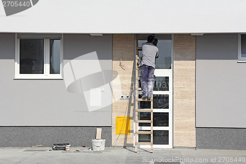 Image of Worker on a ladder