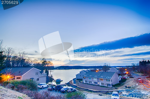 Image of sunset over lake and residential area at lake wylie