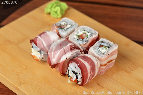 Image of Sushi roll with bacon