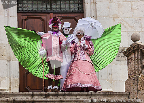 Image of Three Disguised Persons