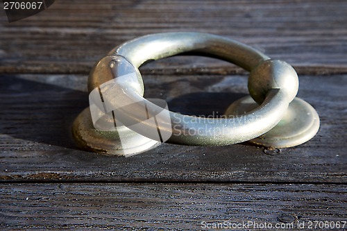 Image of knocker abstract doorin the brown spain