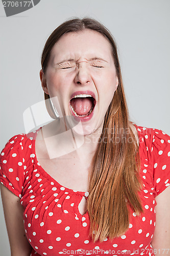 Image of Stressed attractive woman shouting