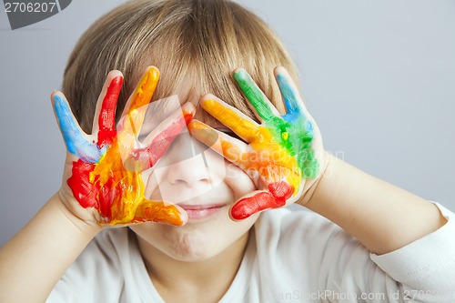 Image of hands painted  in colorful paints