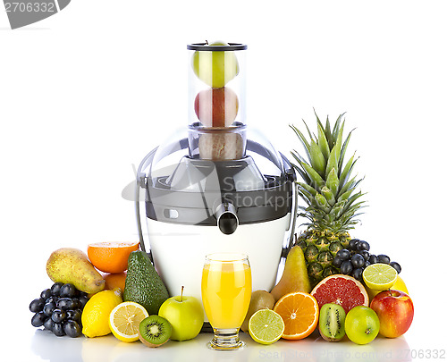 Image of Fresh fruits and glass with juice near white juicer