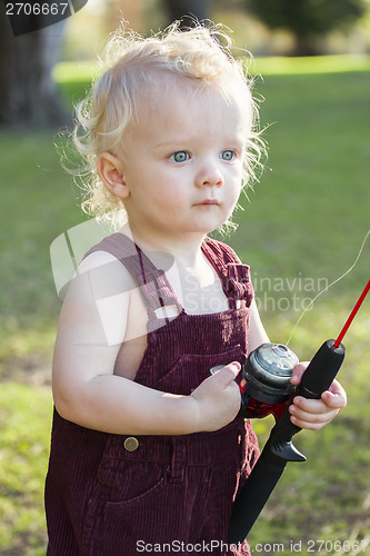Image of Cute Young Boy With Fishing Pole at The Lake