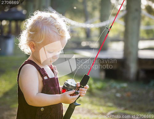 Image of Cute Young Boy With Fishing Pole at The Lake