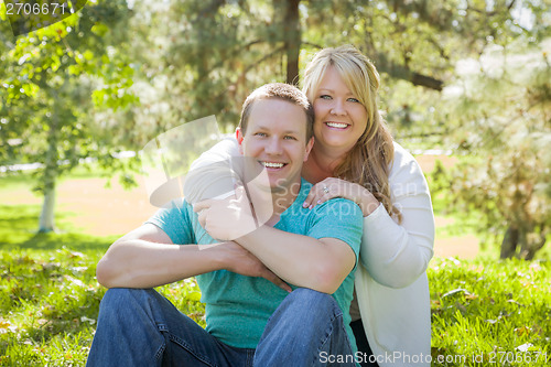 Image of Young Attractive Couple Hugging in the Park