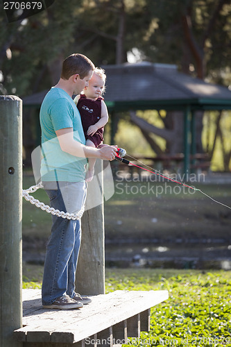 Image of Cute Young Boy and Dad Fishing on the Lake Dock