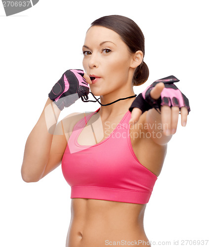 Image of asian personal trainer with whistle