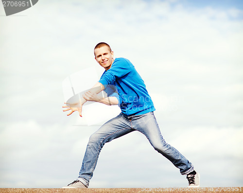 Image of handsome boy making dance move