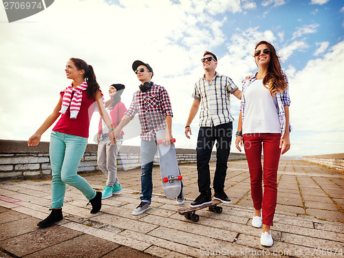 Image of teenagers with skates outside