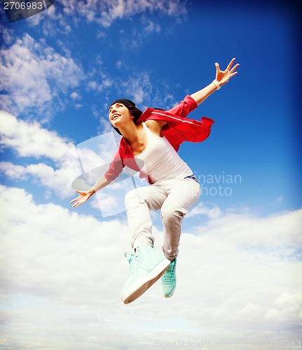 Image of beautiful dancing girl jumping