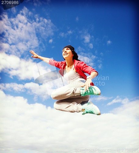 Image of beautiful dancing girl jumping