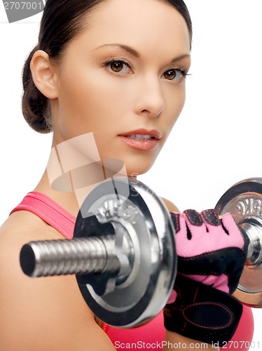 Image of asian sporty woman with heavy dumbbell