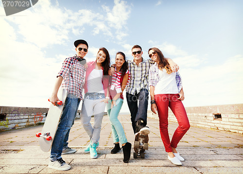 Image of teenagers with skates outside