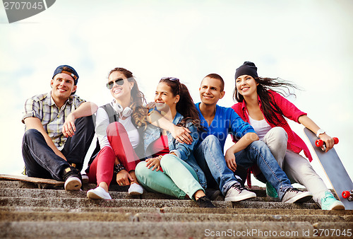 Image of teenagers with skates outside