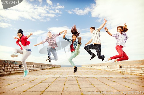 Image of group of teenagers jumping