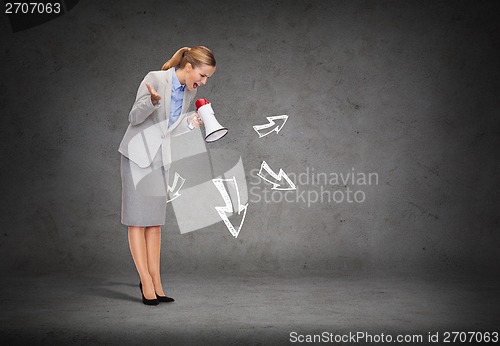 Image of angry businesswoman with megaphone