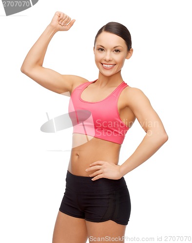 Image of asian sporty woman flexing her biceps