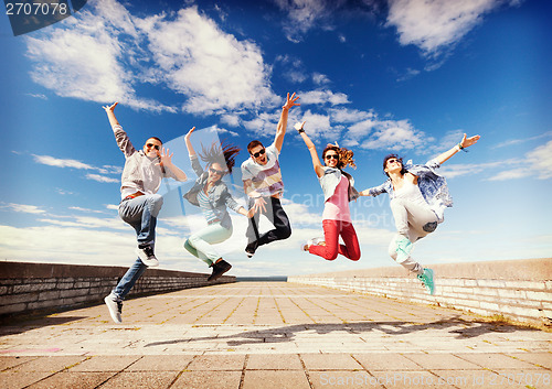 Image of group of teenagers jumping