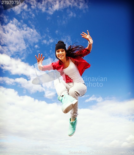 Image of beautiful dancing girl jumping