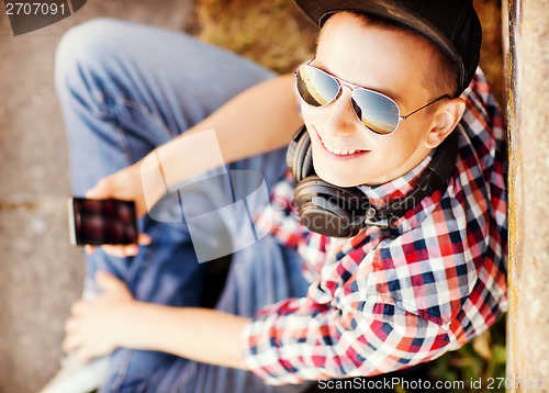 Image of girl with headphones and smartphone