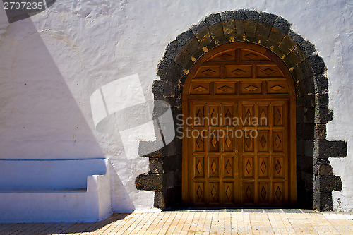 Image of  a brown closed   church door   spain canarias