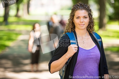 Image of Confident Female Student Standing At Campus