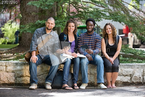 Image of Portrait Of University Students Sitting On Campus