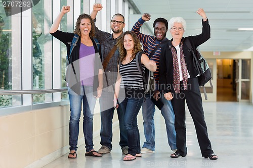 Image of University Students Cheering with Professor