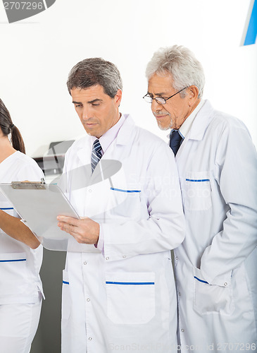 Image of Researchers Reading Clipboard