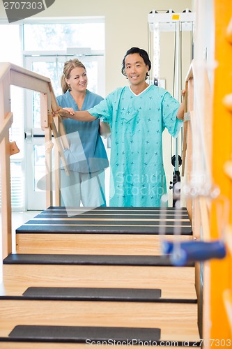 Image of Patient Being Assisted By Physical Therapist