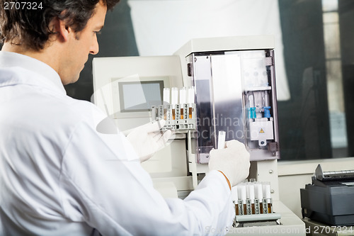 Image of Technician Performing Urine Analysis In Lab